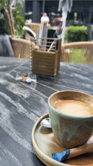Coffee break documented at Warsaw outdoor cafe