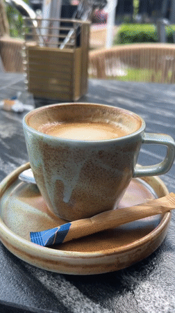 Coffee break documented at Warsaw outdoor cafe