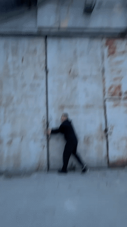 Man loads 'Kiko's Rides' trailer onto SUV in early morning Varna
