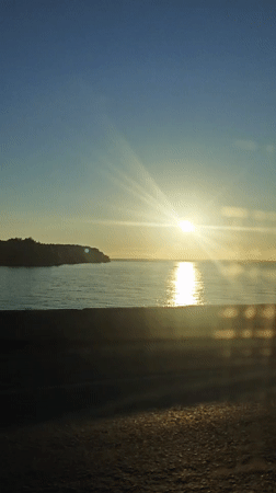 Sunrise captured on video over water near Noviy, Russia