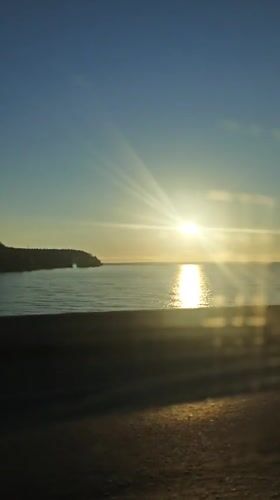 Sunrise captured on video over water near Noviy, Russia