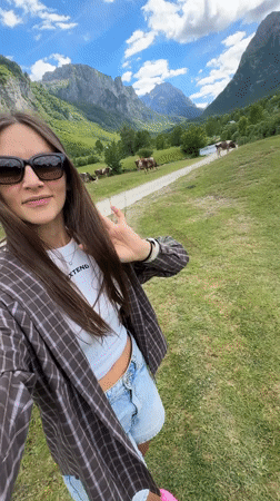 Tourist documents pastoral mountain scenery in rural Montenegro village