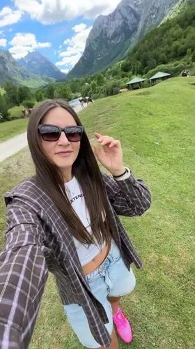 Tourist documents pastoral mountain scenery in rural Montenegro village