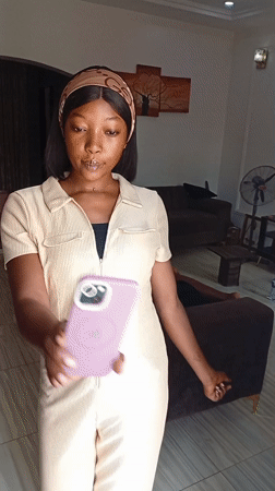 Woman takes selfies at home in Basawa Nigeria