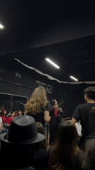Orchestral concert in San Bernardino Tlaxcalancingo, conductor leading red-shirted ensemble