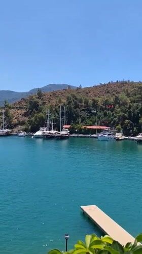 Sailboats at rest in Fethiye's turquoise harbor