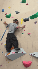 Climber practices bouldering at indoor gym in Sochi