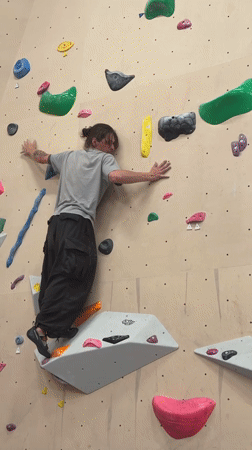 Climber practices bouldering at indoor gym in Sochi