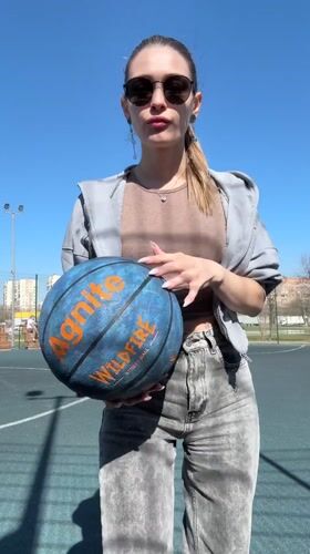 Casual Basketball Playing Captured at Outdoor Court in Reutov