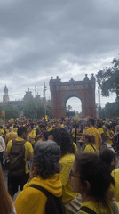 Yellow-shirted demonstrators gather at Barcelona's Arc de Triomf