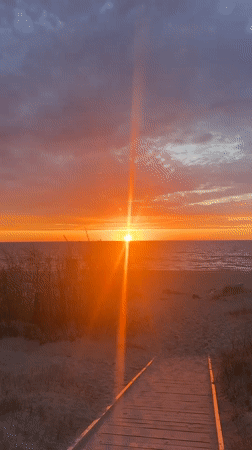 Sunset observed over Lilaste beach with wooden boardwalk