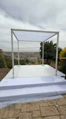 Jewish wedding chuppah erected in Jerusalem under cloudy skies