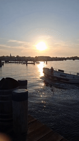 Evening boat traffic observed at Nantucket Harbor during sunset