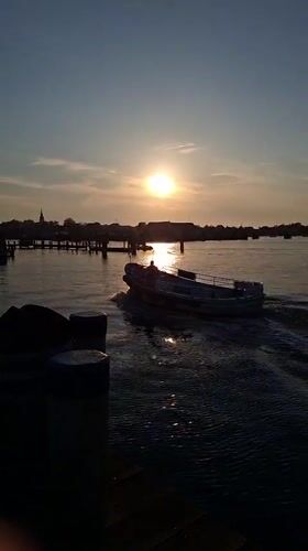 Evening boat traffic observed at Nantucket Harbor during sunset