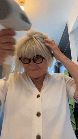 Woman documents morning routine in French bathroom
