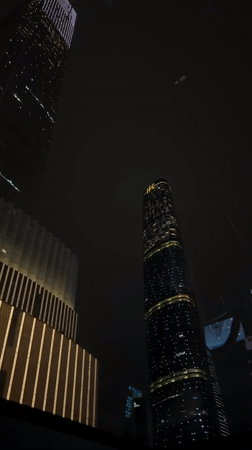 Nighttime city lights captured across Haizhu District skyscrapers