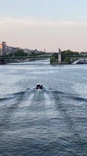 Seine riverfront and Eiffel Tower area at golden hour