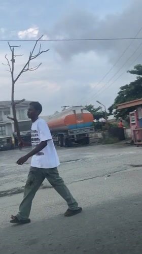Evening street activity in Ado, Nigeria, palm fronds and all