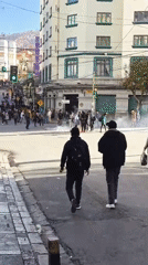 White smoke rises from crowded La Paz intersection