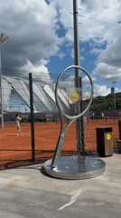 Tennis sculpture, blooming hydrangeas, and an orange McLaren in Moscow