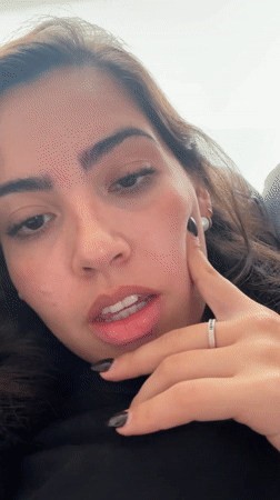 Woman records selfie videos while working on design project