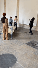 Four women gathered in sparse Paris room