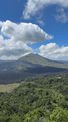 Tourist visits scenic mountain overlook in Kintamani, Indonesia