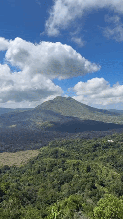 Tourist visits scenic mountain overlook in Kintamani, Indonesia