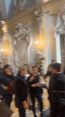 Visitor documents ornate Italian villa galleries and lakeside gardens