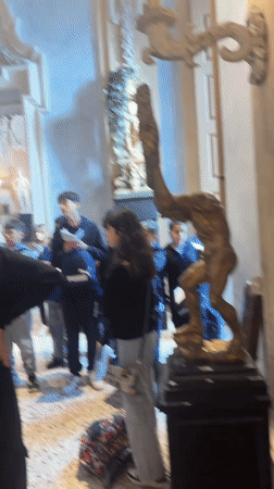 Visitor documents ornate Italian villa galleries and lakeside gardens