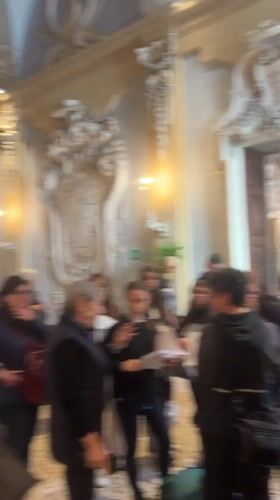 Visitor documents ornate Italian villa galleries and lakeside gardens