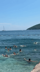 Sunny afternoon swim in Budva's calm Adriatic waters