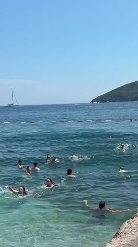 Sunny afternoon swim in Budva's calm Adriatic waters