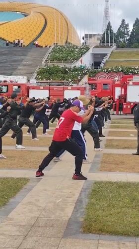 Early morning martial arts training session in Da Lat plaza