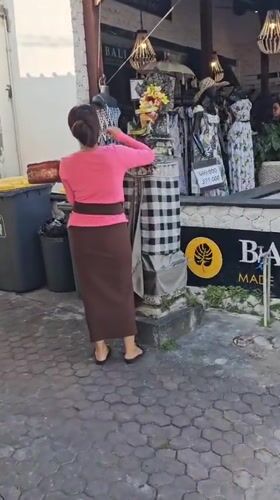 Early morning street life captured in Denpasar, Indonesia