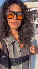 Woman takes selfie on sunny day in Rio de Janeiro