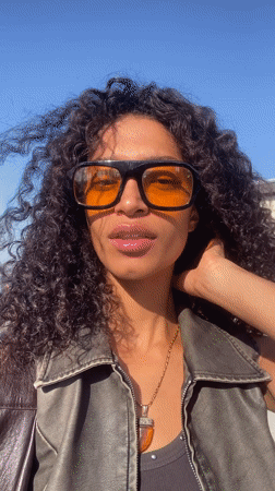 Woman takes selfie on sunny day in Rio de Janeiro
