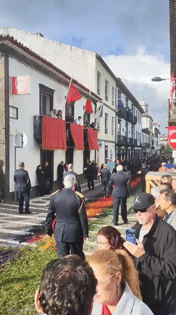 Firefighters and marching band parade through Ponta Delgada streets