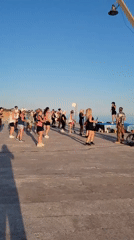 Outdoor fitness class on Quarteira's beachfront promenade