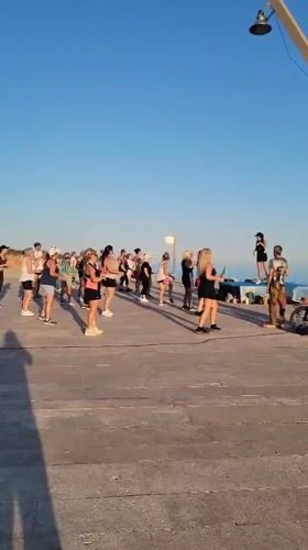 Outdoor fitness class on Quarteira's beachfront promenade
