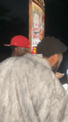 Night market activity documented at Nigerian suya food stalls