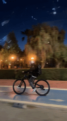 Evening cyclist spotted on bike path in Fethiye, Turkey