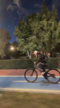 Evening cyclist spotted on bike path in Fethiye, Turkey