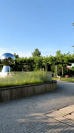 Morning park visit features chrome baby head sculptures in Krasnodar