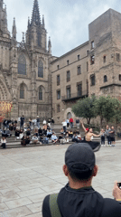 Street performers draw crowds at Barcelona cathedral plaza