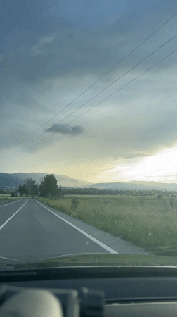 Motorist drives through rural Bulgarian countryside near Ihtiman