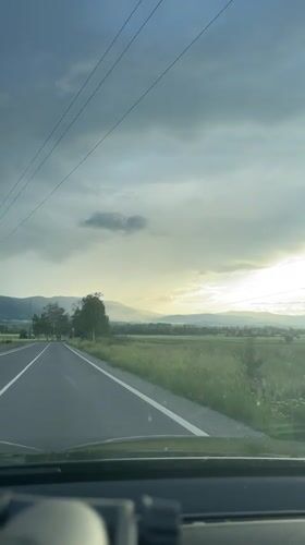 Motorist drives through rural Bulgarian countryside near Ihtiman