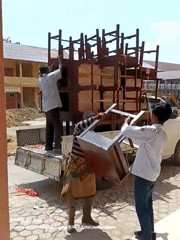 School furniture loading operation documented in Lhokseumawe, Indonesia