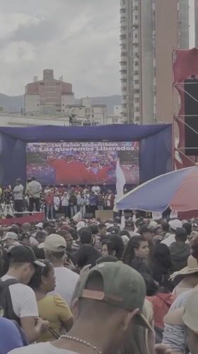 Political demonstration draws crowds in Caracas with flags, signs