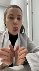 Woman in lab coat makes playful expressions in Moscow